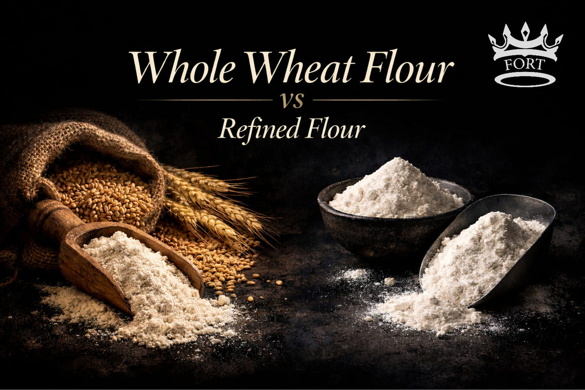 Comparison of whole wheat flour & refined flour displayed on a dark rustic surface, highlighting texture & color differences between the two.