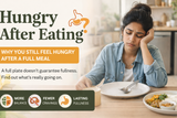 Hungry after eating shown with woman still feeling hungry after a full meal and empty plate