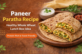 Paneer Paratha Recipe showing whole wheat stuffed paneer parathas on a wooden plate with yogurt and pickle